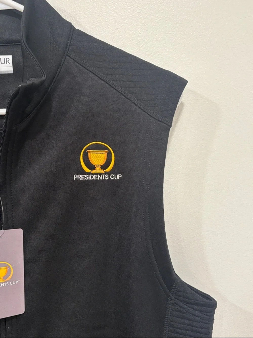 PGA TOUR Black Presidents Cup Sleeveless Zip Vest with Yellow Logo